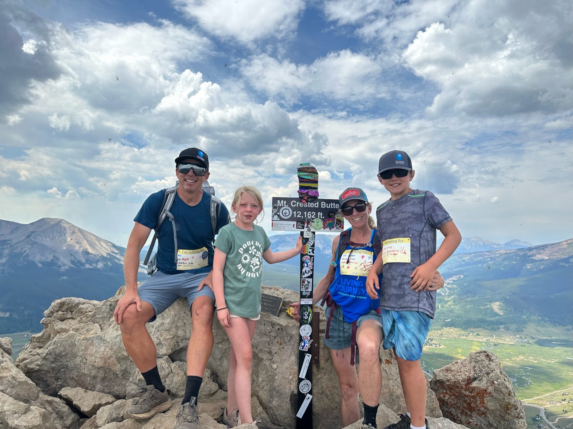 Family of four at the summit of Mt Crested Butte